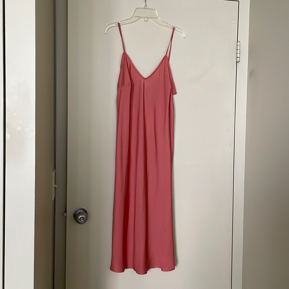 The oh so popular slip dress in coral. Beautiful with or without a jacket.
